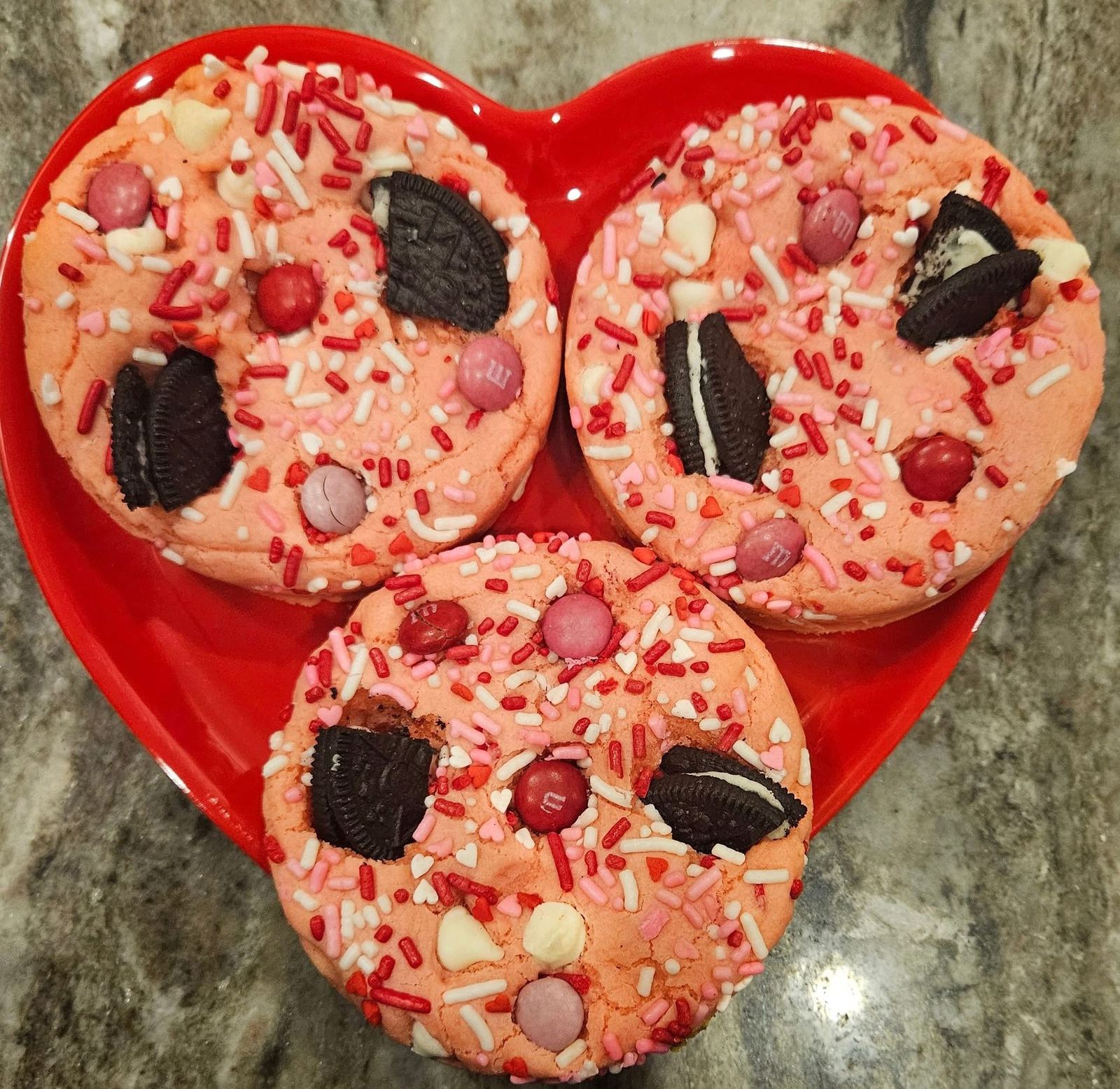 Loaded Valentine cookies with Oreo pieces and M&Ms on a heart plate